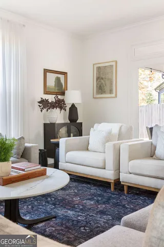 a living room with furniture and a rug