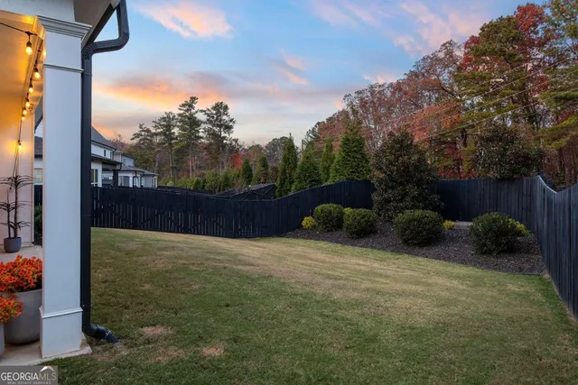 a view of a house with a yard and plants