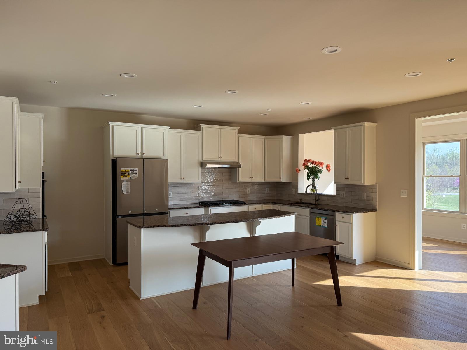 1108 Autumn Brook Avenue Silver Spring, MD 20906 - Photo 2 of 68 a kitchen with stainless steel appliances wooden floor and chair