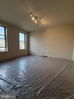 a bathroom with a double vanity sink mirror and bathtub