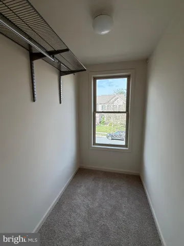 a bathroom with a toilet and a bathtub