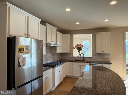 a bathroom with a double vanity sink and mirror