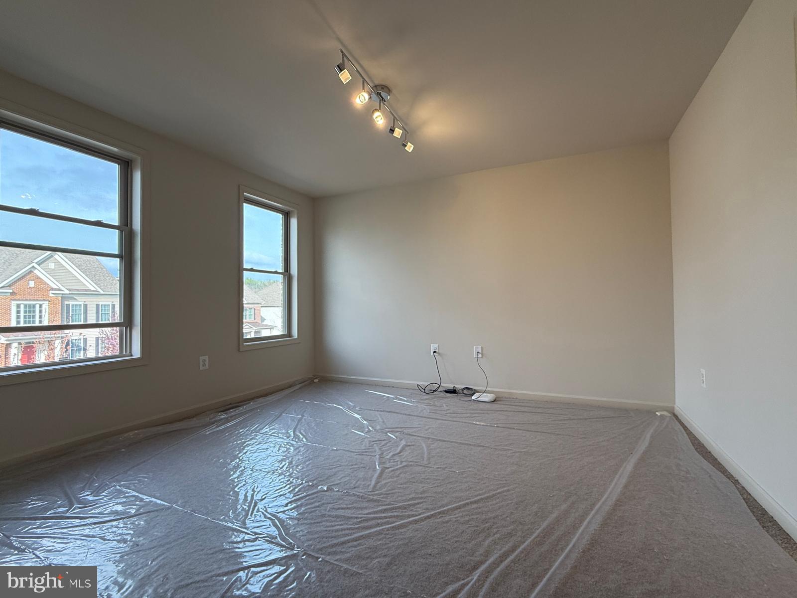 1108 Autumn Brook Avenue Silver Spring, MD 20906 - Photo 34 of 68 an empty room with wooden floor and windows