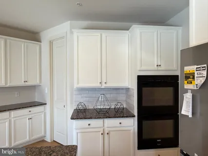 a view of a kitchen with a sink and dishwasher