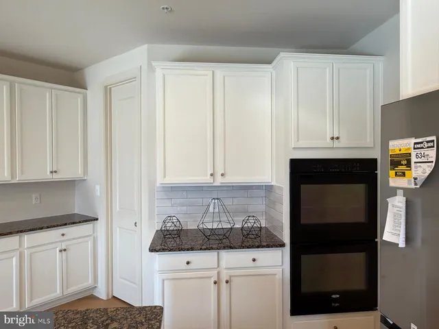 a view of a kitchen with a sink and dishwasher