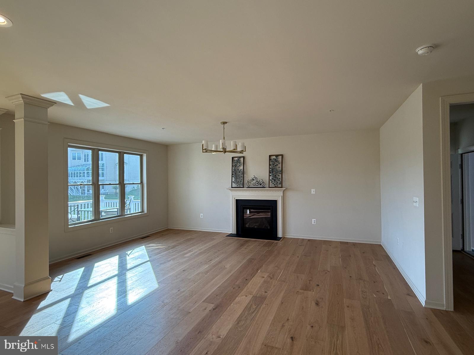1108 Autumn Brook Avenue Silver Spring, MD 20906 - Photo 6 of 68 wooden floor in an empty room with a window
