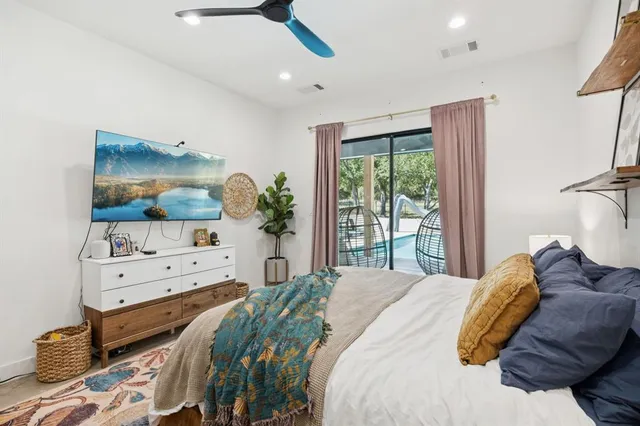 a bedroom with a bed and window