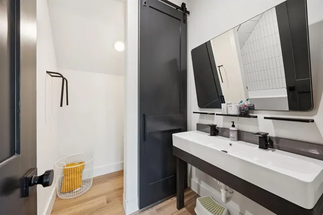 a bathroom with a sink vanity and a mirror