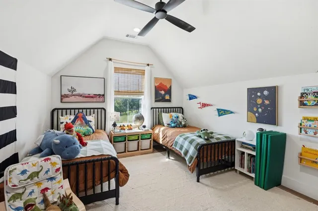 a bedroom with furniture and a chandelier