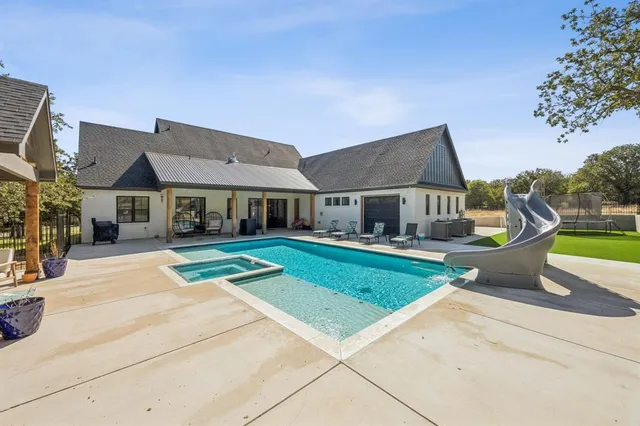 a view of house with outdoor space and sitting area