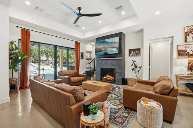 a living room with furniture and a fireplace