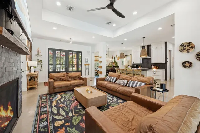 a living room with furniture fireplace and a flat screen tv