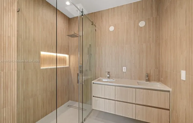 a bathroom with a shower and a tub