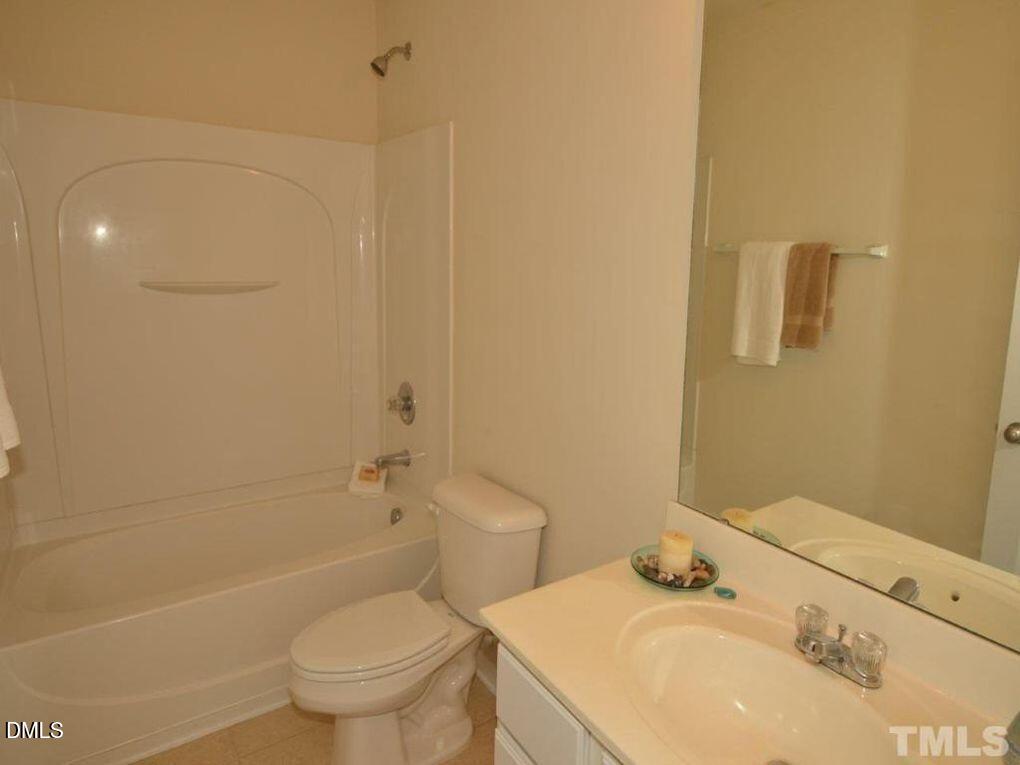 114 Gallent Hedge Trail Apex, NC 27539 - Photo 11 of 18 a bathroom with a sink toilet and shower
