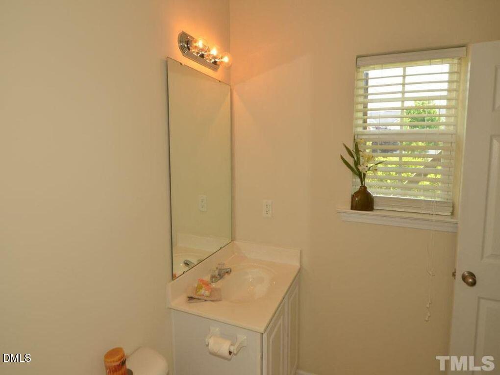 114 Gallent Hedge Trail Apex, NC 27539 - Photo 13 of 18 a bathroom with a sink and a window