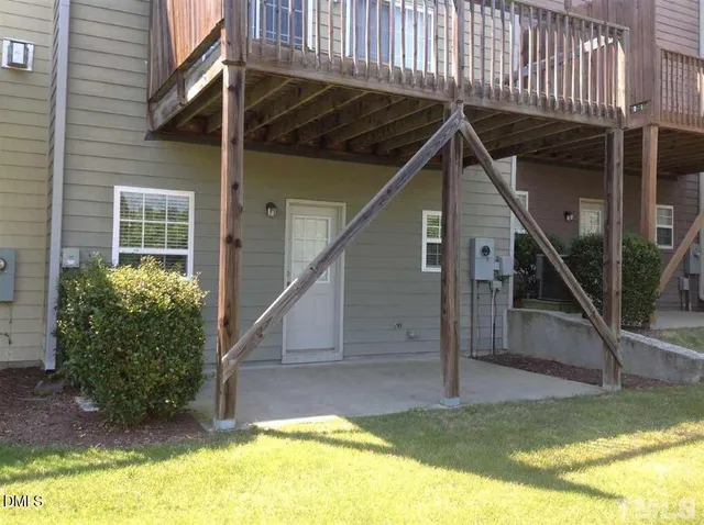 a view of an house with swimming pool and porch
