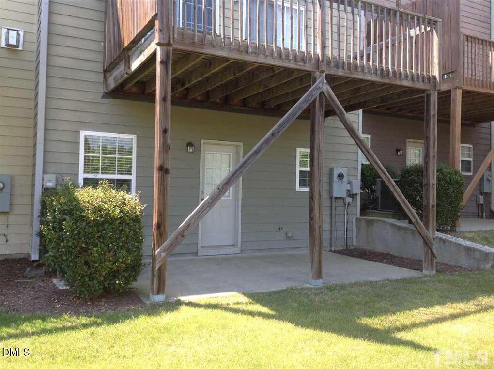 114 Gallent Hedge Trail Apex, NC 27539 - Photo 14 of 18 a view of an house with swimming pool and porch