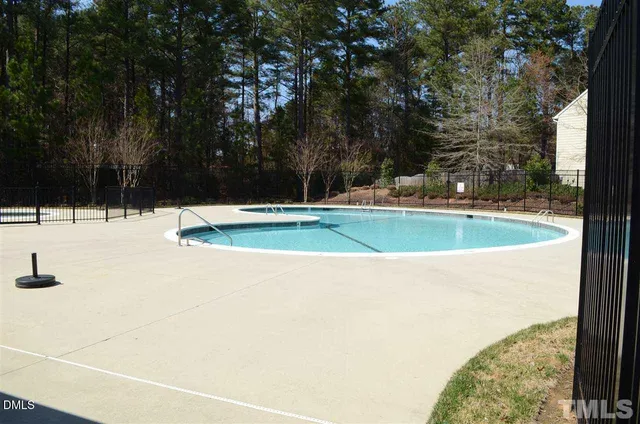 a view of swimming pool with trees