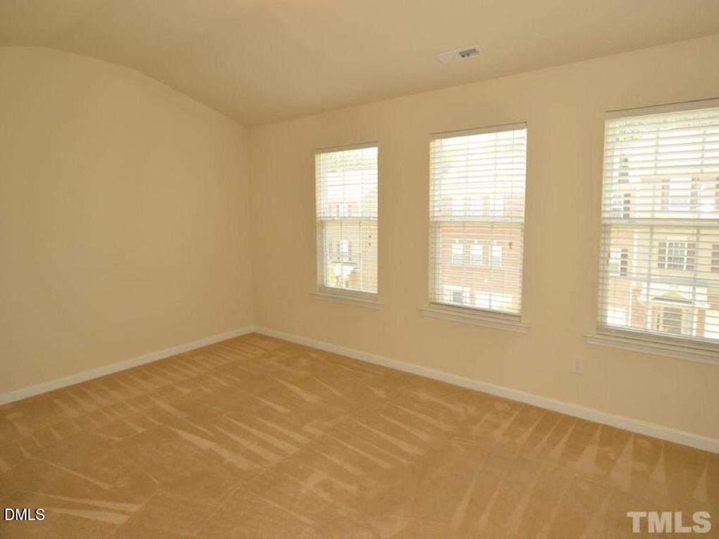 114 Gallent Hedge Trail Apex, NC 27539 - Photo 7 of 18 a view of an empty room with a window