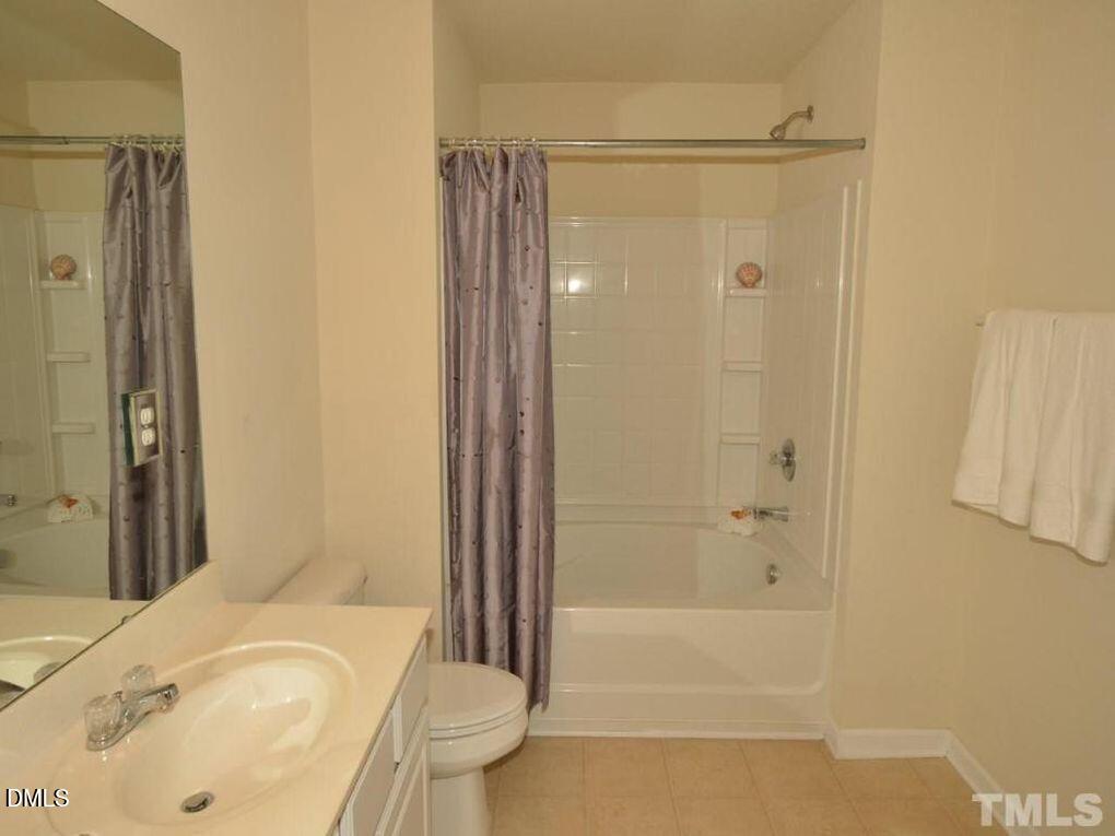 114 Gallent Hedge Trail Apex, NC 27539 - Photo 9 of 18 a bathroom with a sink and a tub