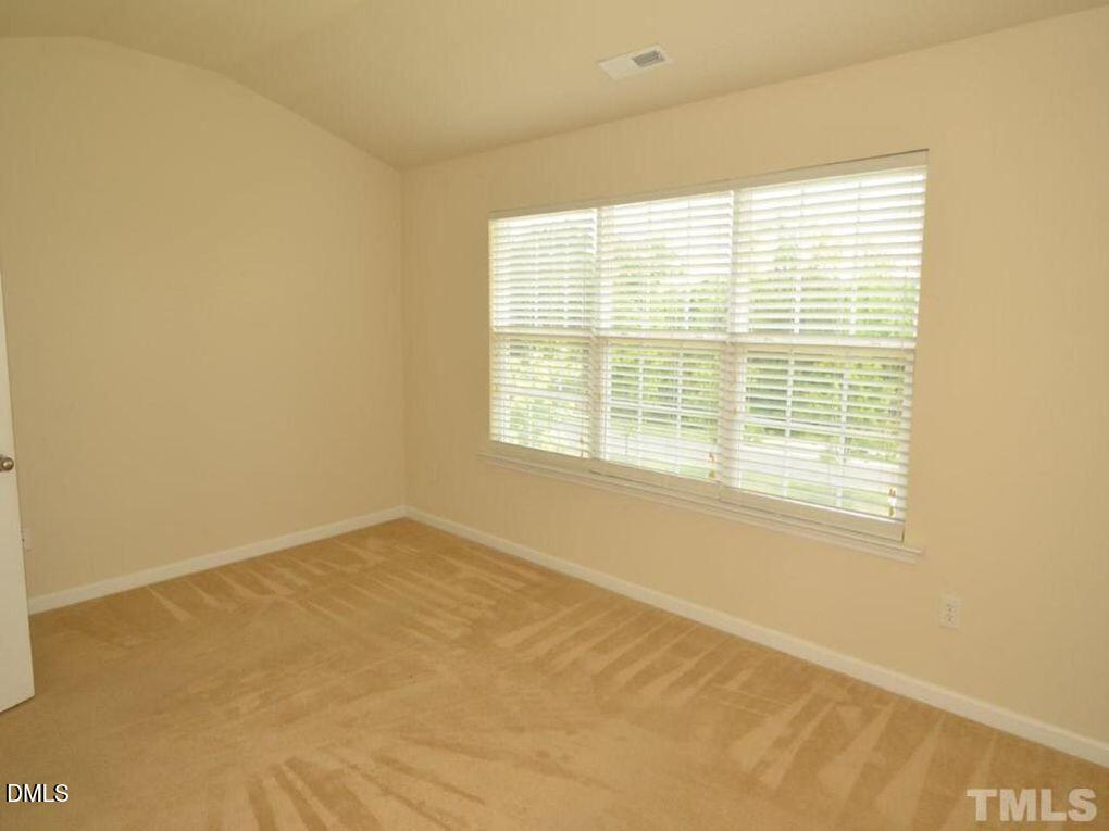 114 Gallent Hedge Trail Apex, NC 27539 - Photo 10 of 18 a view of an empty room with a window