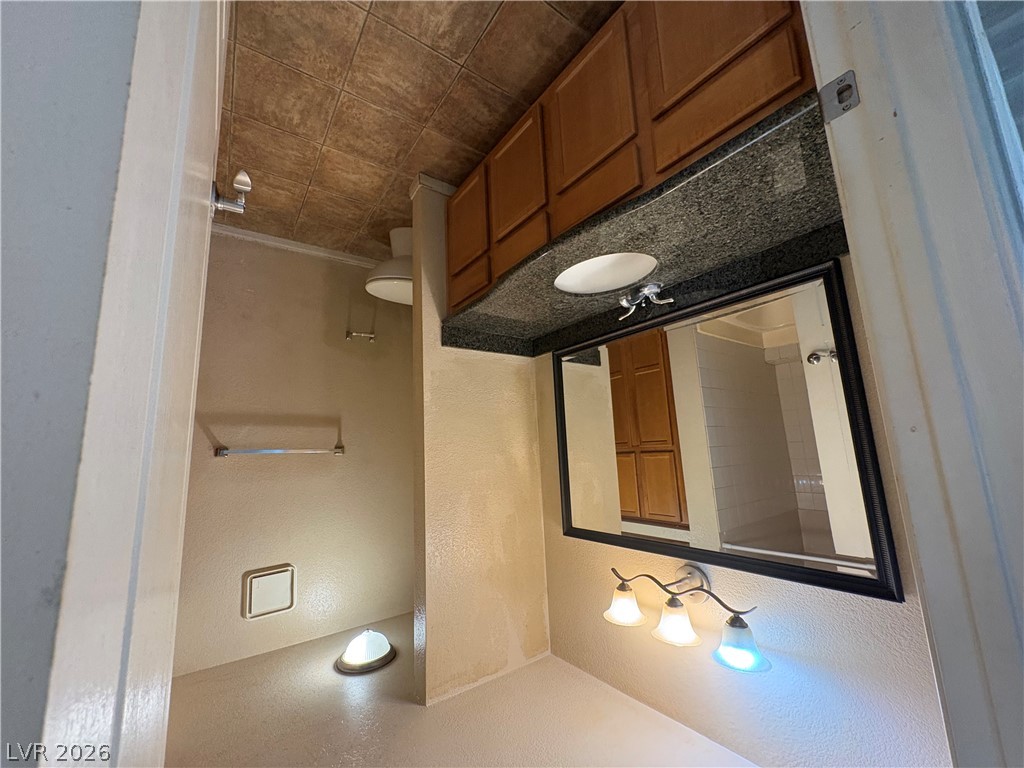 9325 West Desert Inn Road, Unit 123 Las Vegas, NV 89117 - Photo 23 of 36 A compact bathroom offers essential fixtures, providing both practicality and privacy.
