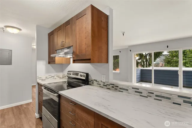 a kitchen with a stove and a sink