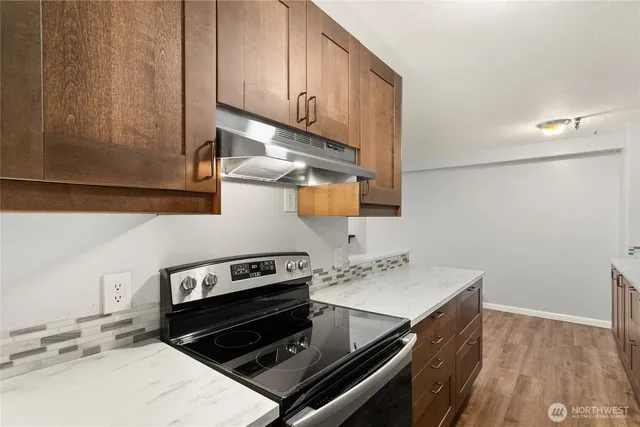 a kitchen with a stove and a sink