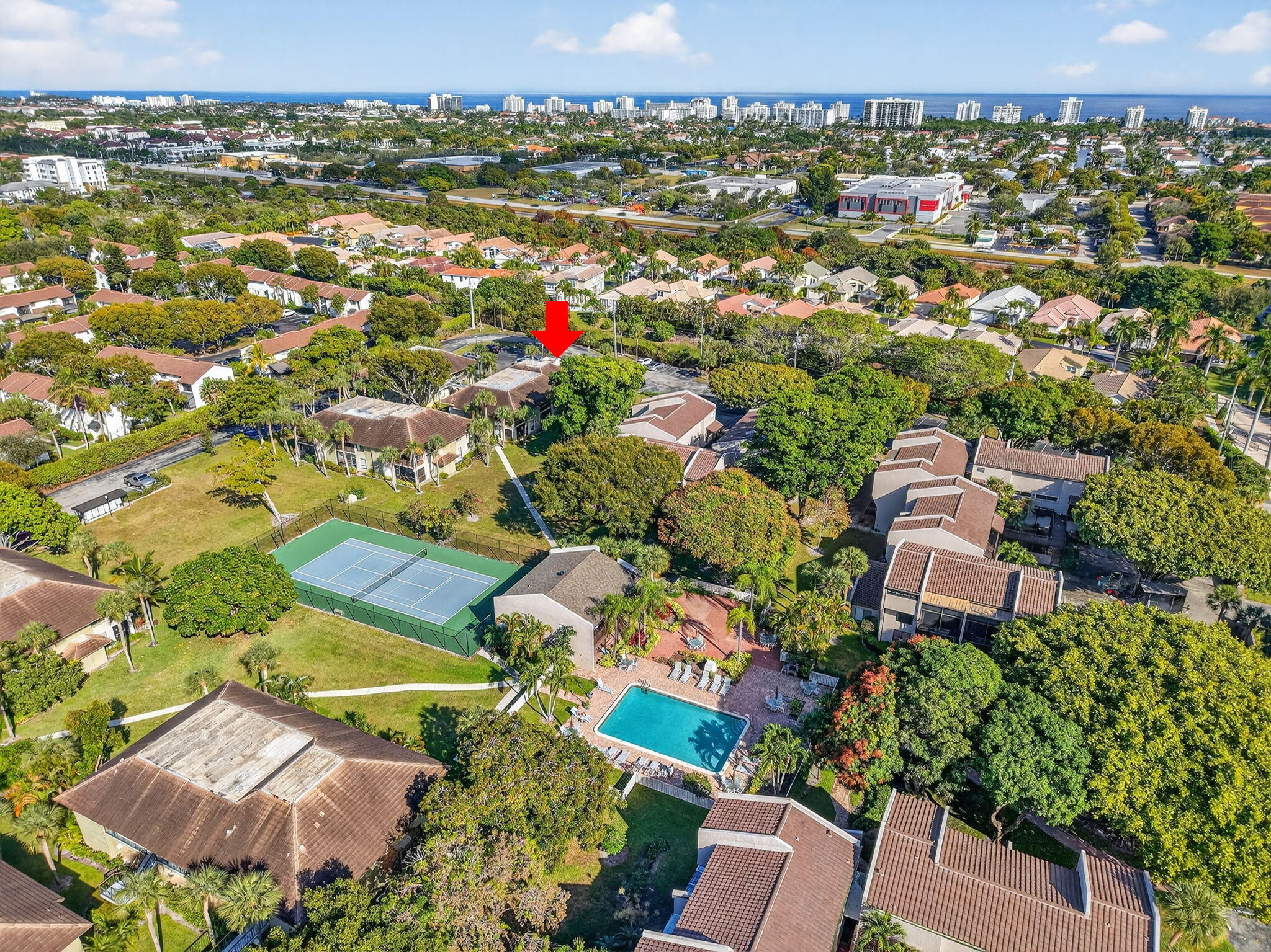 159 Northwest 70th Street, Unit 403 Boca Raton, FL 33487 - Photo 1 of 30 an aerial view of a houses with a swimming pool