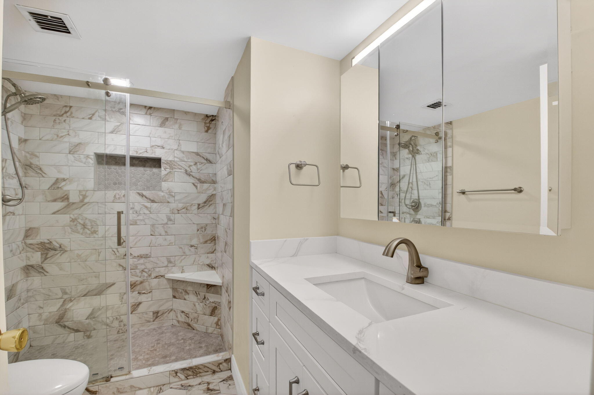 159 Northwest 70th Street, Unit 403 Boca Raton, FL 33487 - Photo 17 of 30 a bathroom with a sink shower and a mirror