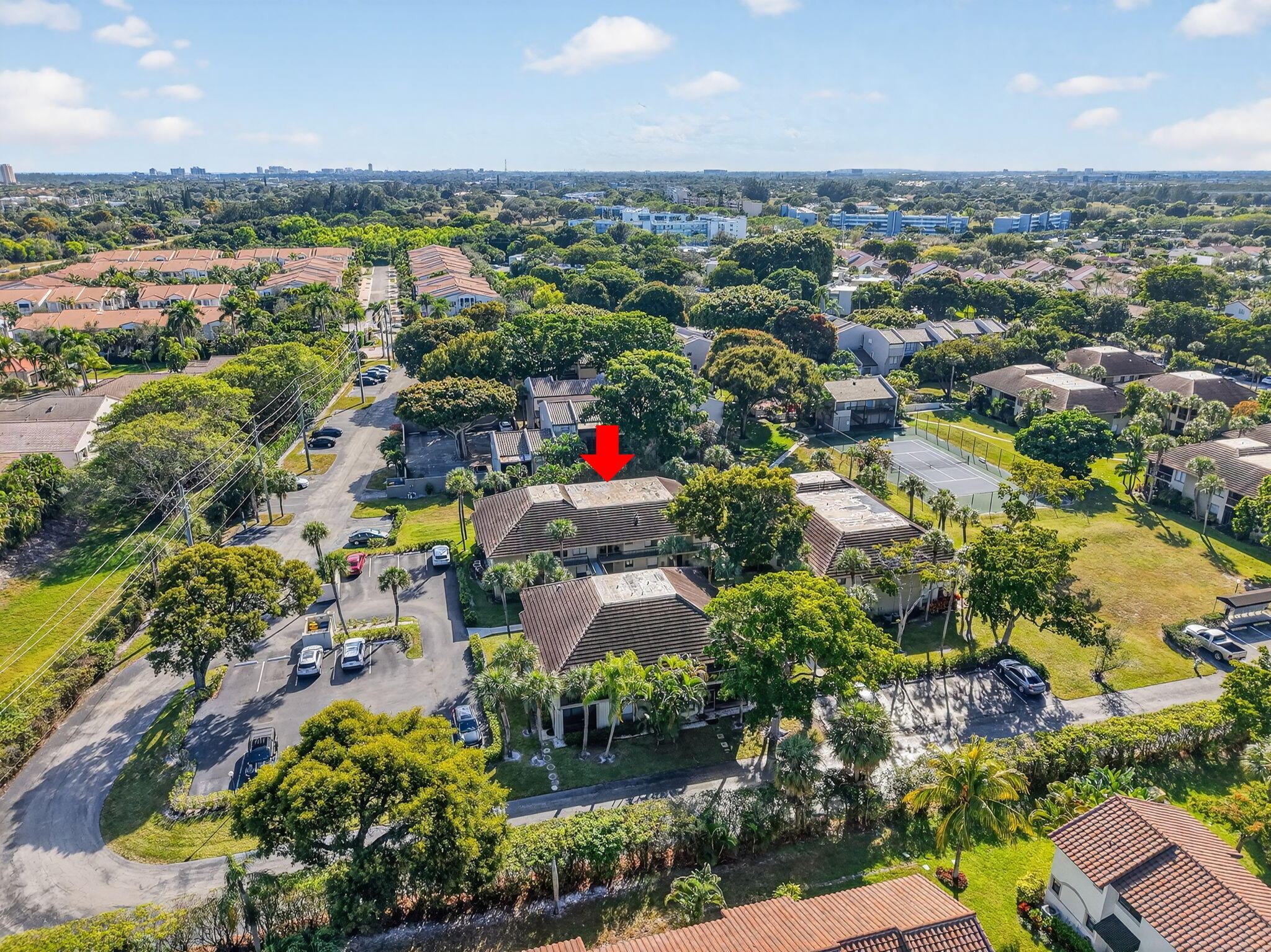 159 Northwest 70th Street, Unit 403 Boca Raton, FL 33487 - Photo 21 of 30 an aerial view of a city with lots of residential buildings ocean and mountain view in back