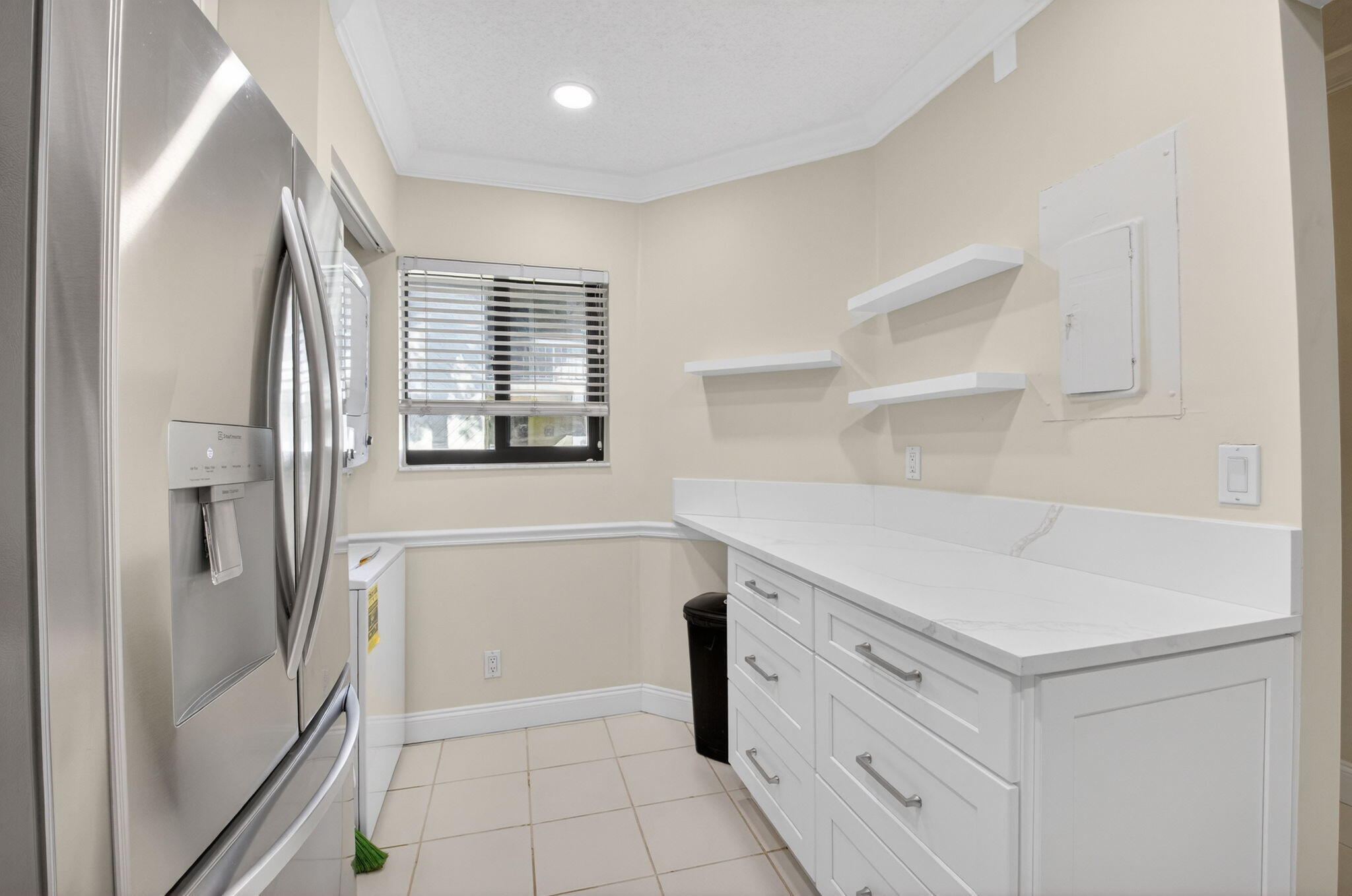 159 Northwest 70th Street, Unit 403 Boca Raton, FL 33487 - Photo 5 of 30 a view of kitchen with cabinets and wooden floor