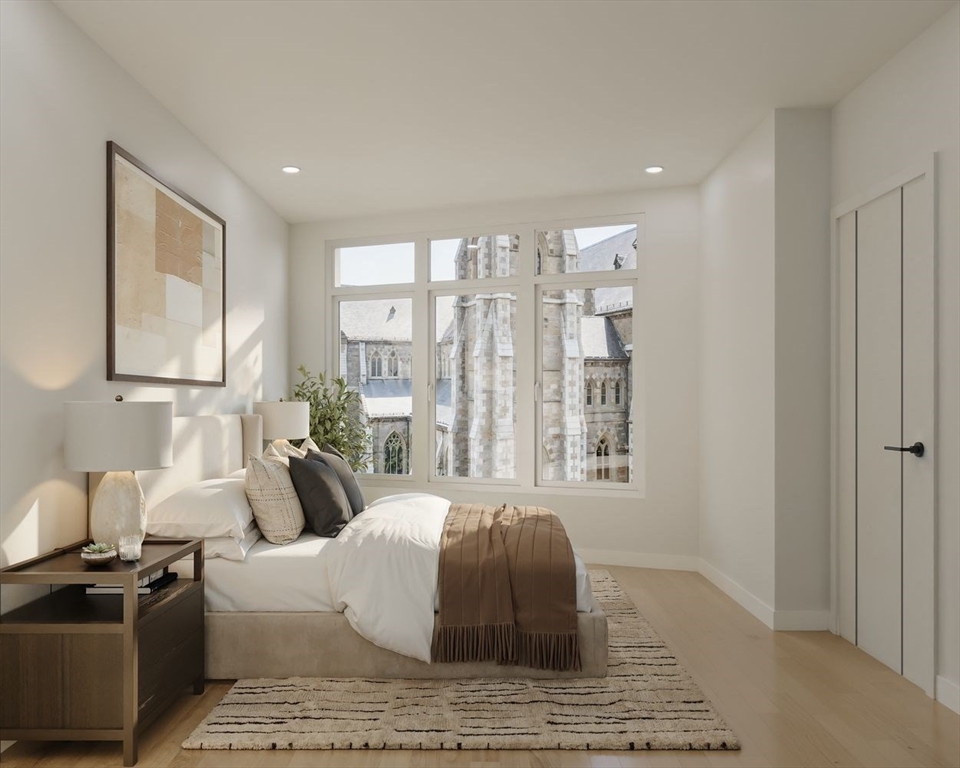 1395 Washington Street, Unit 306 Boston, MA 02118 - Photo 8 of 23 a living room with furniture and a large window
