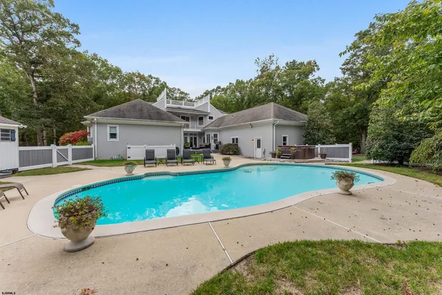 a kitchen with stainless steel appliances kitchen island granite countertop a stove a sink and a refrigerator