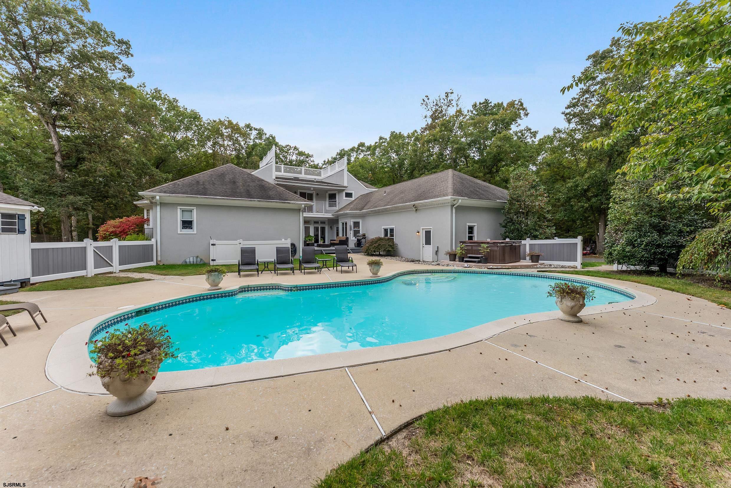 535 West Cologne Port Road Port Republic, NJ 08215 - Photo 15 of 99 a front view of a house with swimming pool