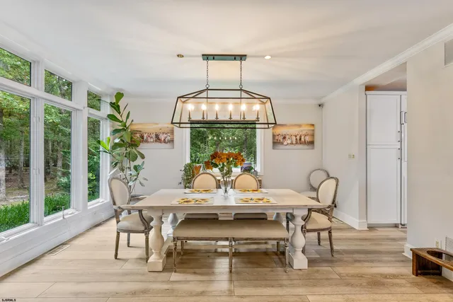 a living room with furniture fireplace and a table