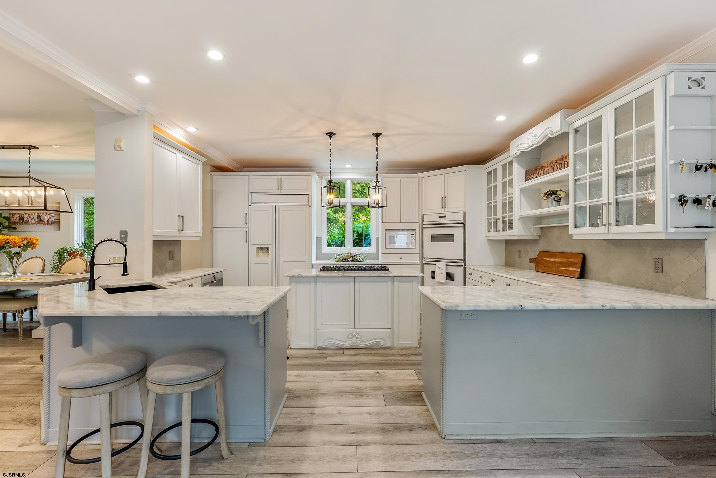 535 West Cologne Port Road Port Republic, NJ 08215 - Photo 29 of 99 a kitchen with stainless steel appliances a sink stove and cabinets