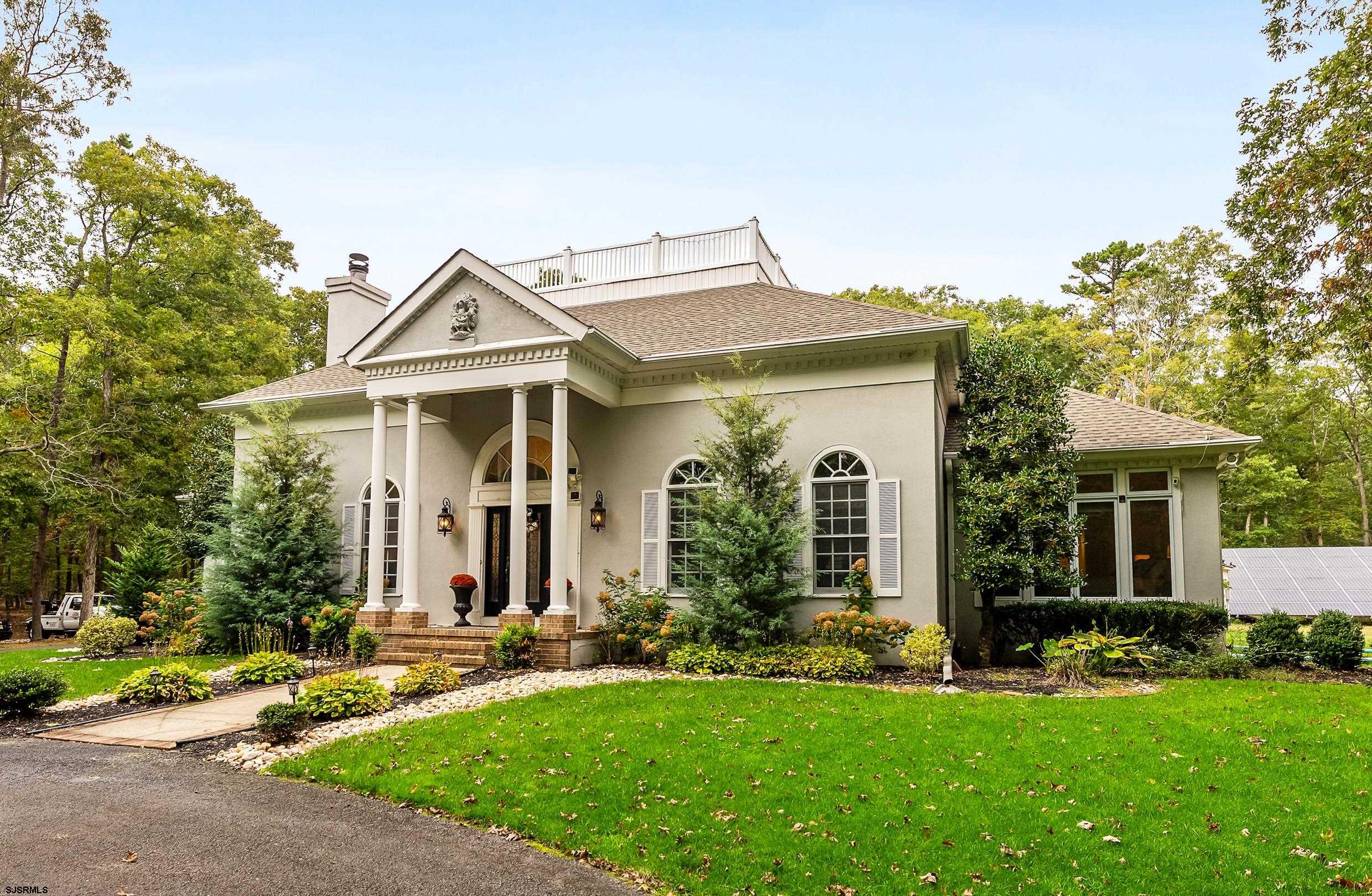 535 West Cologne Port Road Port Republic, NJ 08215 - Photo 4 of 99 a front view of a house with a yard