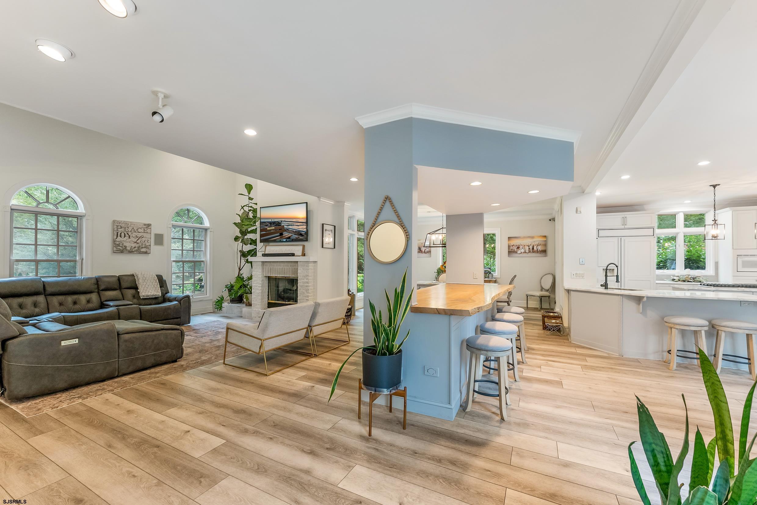 535 West Cologne Port Road Port Republic, NJ 08215 - Photo 42 of 99 a living room with fireplace furniture and a wooden floor
