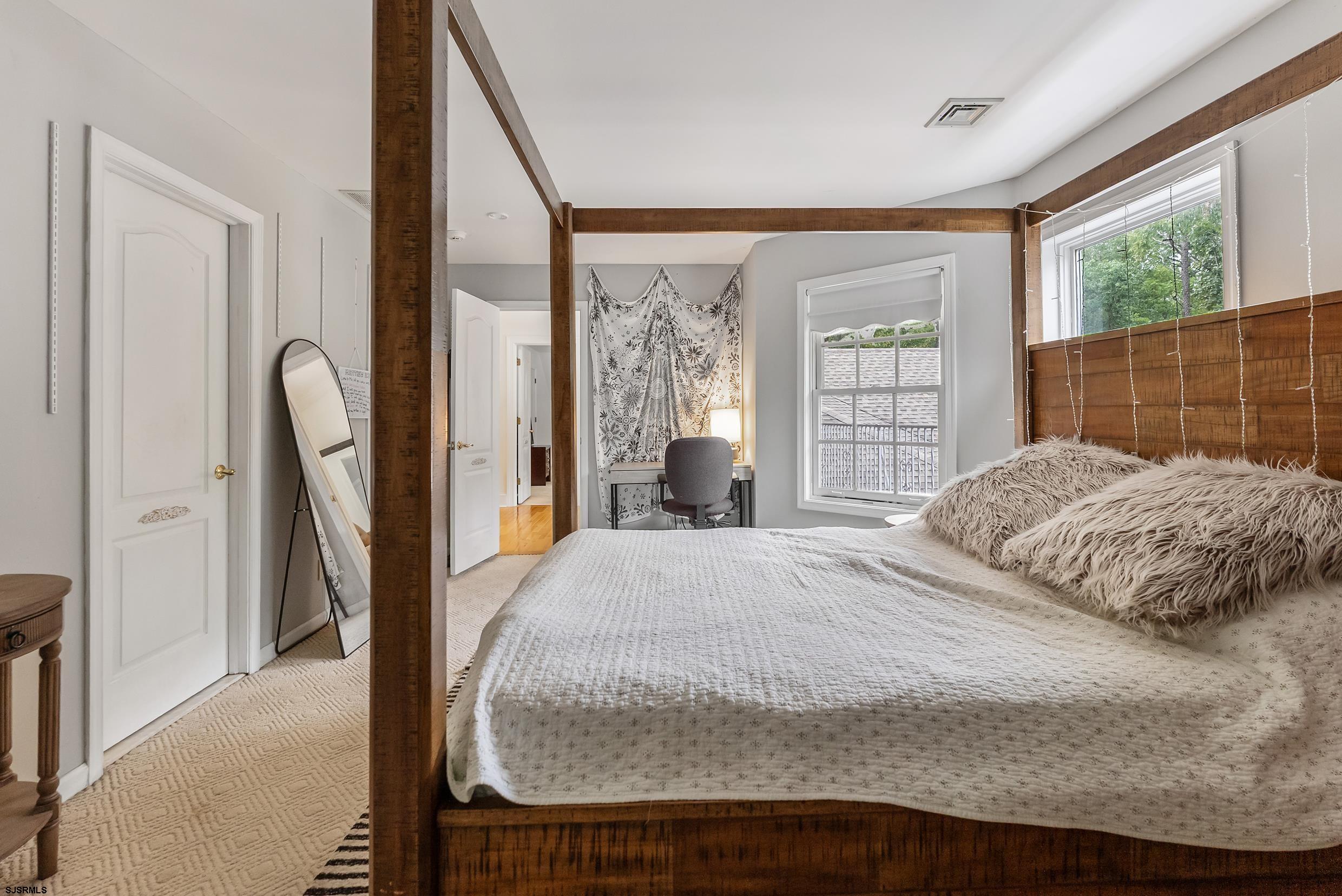 535 West Cologne Port Road Port Republic, NJ 08215 - Photo 52 of 99 a bedroom with a large bed and a large window