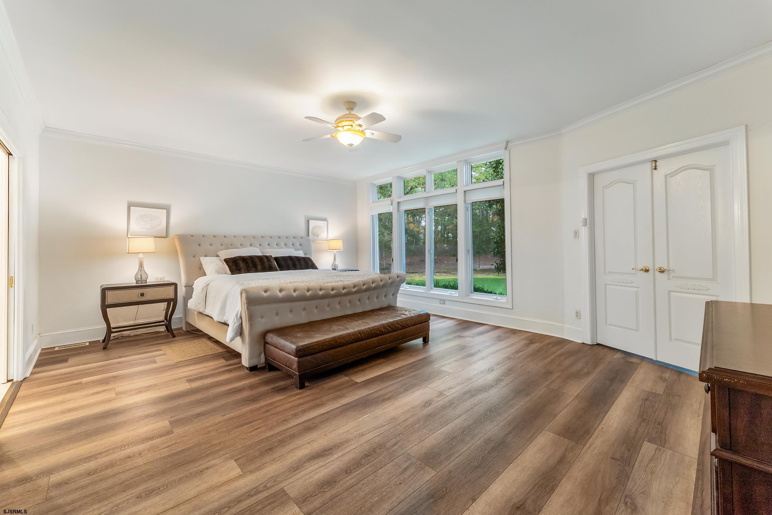 535 West Cologne Port Road Port Republic, NJ 08215 - Photo 65 of 99 a bedroom with a bed and wooden floor