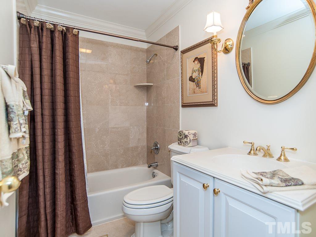 6920 Slade Hill Road Raleigh, NC 27615 - Photo 14 of 30 a bathroom with a sink toilet and shower