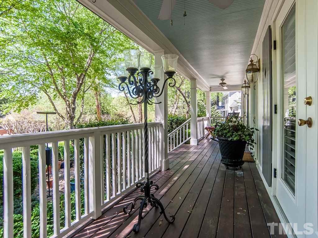 6920 Slade Hill Road Raleigh, NC 27615 - Photo 4 of 30 a view of a balcony with wooden floor