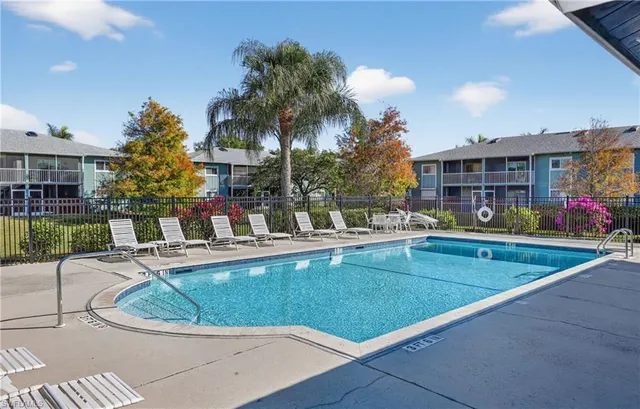a view of a swimming pool with a patio