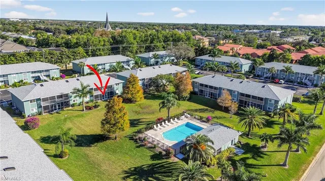 an aerial view of residential houses with outdoor space