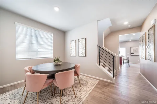 a dining room with table and chairs