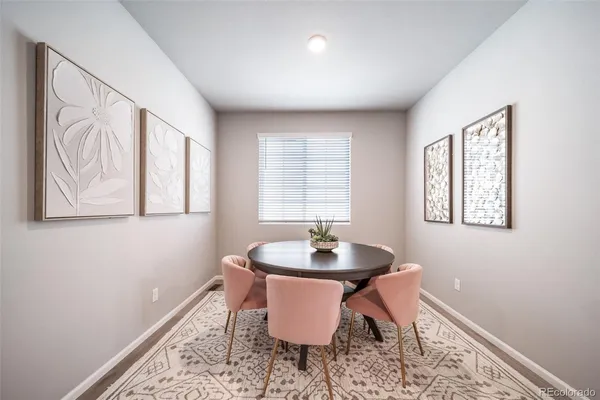 a workspace with furniture window and wooden floor