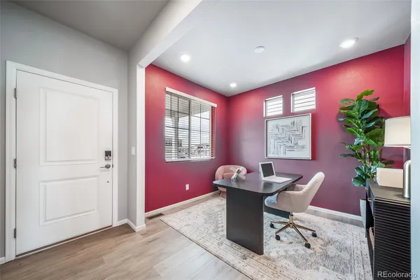 a dining room with furniture and window