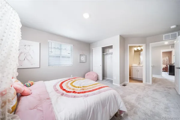 a bed room with a bed and a couch