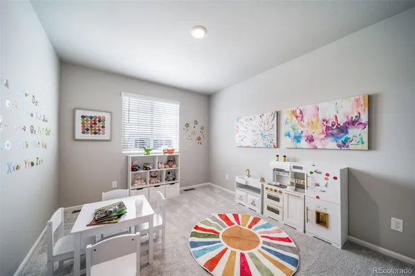 a bedroom with a bed potted plant with the outer view